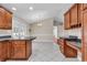 Light-filled kitchen area with tiled floors offering views of the backyard and easy access to the patio at 290 Georgia Mae Loop, Conway, SC 29527