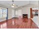 Inviting living room with hardwood floors, fireplace, and plenty of natural light at 290 Georgia Mae Loop, Conway, SC 29527