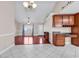 Inviting open-plan living space with hardwood floors, a ceiling fan, and abundant natural light at 290 Georgia Mae Loop, Conway, SC 29527