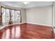 This primary bedroom features natural light, a ceiling fan, and wood-look floors at 290 Georgia Mae Loop, Conway, SC 29527