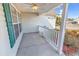 Covered front porch with white railing and a ceiling fan at 290 Georgia Mae Loop, Conway, SC 29527
