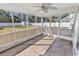 Screened porch with tile floors, ceiling fan, and views of the backyard at 290 Georgia Mae Loop, Conway, SC 29527