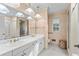 Bathroom with double vanity and gold fixtures at 302 Lafayette Dr., Myrtle Beach, SC 29572