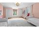 Light pink bedroom with two twin beds and a rug at 302 Lafayette Dr., Myrtle Beach, SC 29572