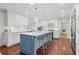 Renovated kitchen with white cabinets, blue island, and hardwood floors at 302 Lafayette Dr., Myrtle Beach, SC 29572