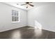 Spacious bedroom with large window, ceiling fan, and wood flooring at 321 Seabert Rd. # 321, Myrtle Beach, SC 29579