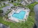 Community pool with lounge chairs and surrounding landscape at 321 Seabert Rd. # 321, Myrtle Beach, SC 29579