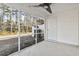 Screened porch with tile floor and ceiling fan at 321 Seabert Rd. # 321, Myrtle Beach, SC 29579