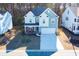 Two-story house with light blue siding, stone accents, and a two-car garage at 3339 Moss Bridge Ln., Myrtle Beach, SC 29579