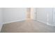 Spacious bedroom with neutral carpet and an adjacent bathroom at 3339 Moss Bridge Ln., Myrtle Beach, SC 29579