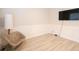 Bright home office features wood-look floors, wainscoting, and a large TV at 3339 Moss Bridge Ln., Myrtle Beach, SC 29579