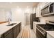 Modern kitchen with stainless steel appliances and kitchen island at 3339 Moss Bridge Ln., Myrtle Beach, SC 29579