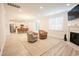 Spacious living room with hardwood floors, fireplace, and kitchen view at 3339 Moss Bridge Ln., Myrtle Beach, SC 29579