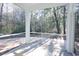 Screened porch overlooking a wooded backyard with brick pavers at 3339 Moss Bridge Ln., Myrtle Beach, SC 29579