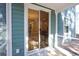 Glass sliding door leads from screened porch to dining area at 3339 Moss Bridge Ln., Myrtle Beach, SC 29579