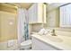 Clean bathroom with tub shower and white vanity at 3601 S Ocean Blvd. # 7-E, North Myrtle Beach, SC 29582
