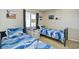 Twin bedroom with nautical bedding and ocean views at 3601 S Ocean Blvd. # 7-E, North Myrtle Beach, SC 29582