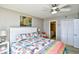 King bedroom with ocean view, ceiling fan, and ensuite bath at 3601 S Ocean Blvd. # 7-E, North Myrtle Beach, SC 29582