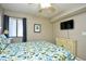 Bright bedroom with a comfortable bed and TV at 3601 S Ocean Blvd. # 7-E, North Myrtle Beach, SC 29582