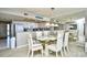 Bright dining area with glass table and seating for six at 3601 S Ocean Blvd. # 7-E, North Myrtle Beach, SC 29582