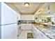 Well-equipped kitchen, granite counters, white cabinets at 3601 S Ocean Blvd. # 7-E, North Myrtle Beach, SC 29582
