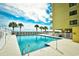 Community pool with ocean view and palm trees at 3601 S Ocean Blvd. # 7-E, North Myrtle Beach, SC 29582