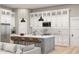 Modern kitchen with white cabinets, a large island, and stainless steel appliances at 364 Ridge Dr., Galivants Ferry, SC 29544