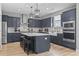 Modern kitchen with dark cabinetry, stainless steel appliances, and a large island at 375 Bumble Circle, Murrells Inlet, SC 29576