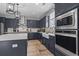 Modern kitchen with a large island, stainless steel appliances, and white quartz countertops at 375 Bumble Circle, Murrells Inlet, SC 29576