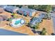Overhead view of a community pool and clubhouse surrounded by lush landscaping at 3923 Gladiola Ct. # 301, Myrtle Beach, SC 29588