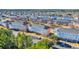 Beautiful aerial view of condo complex, parking lot, pond, and neighborhood at 3923 Gladiola Ct. # 301, Myrtle Beach, SC 29588