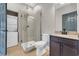 Well-lit bathroom showcasing a glass shower and a stackable washer and dryer at 3923 Gladiola Ct. # 301, Myrtle Beach, SC 29588