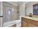 Bright bathroom featuring a glass shower, tiled walls, and a granite-topped vanity at 3923 Gladiola Ct. # 301, Myrtle Beach, SC 29588