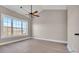 Bedroom featuring hardwood floors, a modern ceiling fan, and a large window at 3923 Gladiola Ct. # 301, Myrtle Beach, SC 29588