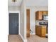 Hallway that leads into the kitchen with hardwood floors and a steel door at 3923 Gladiola Ct. # 301, Myrtle Beach, SC 29588
