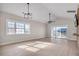 Living room with hardwood floors, a ceiling fan, and sliding glass doors at 3923 Gladiola Ct. # 301, Myrtle Beach, SC 29588