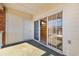 Inviting patio with sliding glass doors revealing a view of a wood-paneled room and TV at 3923 Gladiola Ct. # 301, Myrtle Beach, SC 29588