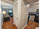 Hallway with access to kitchen and living area. Wood-look flooring runs throughout at 410 Melrose Pl. # 219, Myrtle Beach, SC 29572