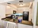 Compact kitchen featuring granite countertops, ample cabinet space, and modern appliances at 410 Melrose Pl. # 219, Myrtle Beach, SC 29572