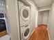 This laundry room features a stacked washer and dryer for space-saving convenience at 410 Melrose Pl. # 219, Myrtle Beach, SC 29572