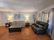 Cozy living room featuring hardwood floors, comfortable seating, and natural light at 410 Melrose Pl. # 219, Myrtle Beach, SC 29572