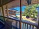Screened-in patio featuring serene views of the landscaped garden and lake at 410 Melrose Pl. # 219, Myrtle Beach, SC 29572