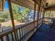 Screened-in patio offers tranquil views of the surrounding trees and landscape at 410 Melrose Pl. # 219, Myrtle Beach, SC 29572