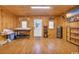 Finished basement with wood walls, a door and shelving at 5101 Wesley Rd., Murrells Inlet, SC 29576