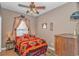 Bedroom with southwestern decor, a comfy bed, and wood floors at 6001-1810 S Kings Hwy., Myrtle Beach, SC 29575