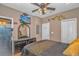 Bedroom with TV, dresser, and gold bedding at 6001-1810 S Kings Hwy., Myrtle Beach, SC 29575