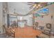 Open-plan kitchen with white cabinets, island, and dining area at 6001-1810 S Kings Hwy., Myrtle Beach, SC 29575