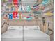 Laundry closet with washer, dryer, and ample shelving at 6001-1810 S Kings Hwy., Myrtle Beach, SC 29575
