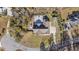 Aerial view showcasing the home's layout, pool, deck, and surrounding wooded landscape at 640 Fox Hollow Rd., Murrells Inlet, SC 29576