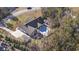Aerial view of a gray home with a large backyard, pool, and patio at 640 Fox Hollow Rd., Murrells Inlet, SC 29576